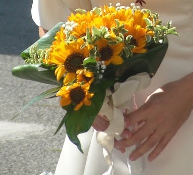 Sunflowers white roses and white calla lilies bridal bouquet