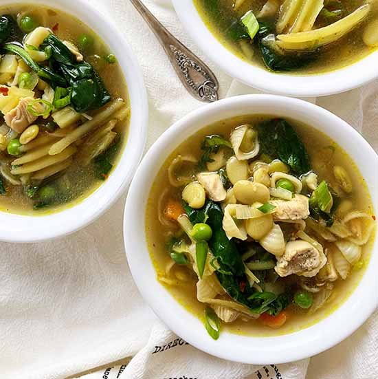 Bowls of Italian green minestrone soup