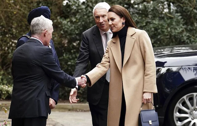 Princess of Wales wore a camel coat by Max & Co. Emmy London navy block heel pumps. Polene Paris navy bag