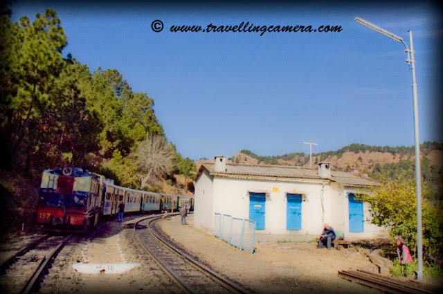 Small and Beautiful Railway Stations on Kalka-Shimla narrow track: Posted on www.travellingcamera.com by VJ: The Kalka-Shimla Railway built to connect the summer capital of India in 1903 at an altitude of 2076 meters offers a panoramic experience of the picturesque Himalayas from the shivalik foot hills at Kalka to several important points such as Dharampur, Solan, Kandaghat, Taradevi, Barog, Salogra, Summerhill, Shimla and beyond up to the silvery snow line near the towering peaks.Sonwara Railway Station on the way to Shimla from Kalka...Himalyan Queen waits for 30 minutes at this station to let Shivalik Express pass through....  KOTI Railway Station on the way to Shimla from Kalka...I have clicked these photographs during recent visit to Shimla.... We reach KOTI Railway Station after crossing longest Barog tunnel....Jabali Railway Station on the way to Shimla from Kalka...Kandaghat Railway Station on the way to Shimla from Kalka...Located at an altitude of 4680 ft above sea level Kandaghat is the nice place in Himachal Pradesh for you if are looking for a quiet and peaceful vacation. Maharaja Bhupinder Singh built his palace in Kandaghat after which this place received the attention. Raja Bhupinder Singh was the ruler of Patiala and when he was expelled from Shimla, he set up base in Kandaghat. Today, this is one of the most popular destinations to travel in India.  A reflection of Kandaghat Railway Station on train window...Dharmpur Railway Station on the way to Shimla from Kalka..Just 15 km from Kasauli on the National highway No.22 Dharampur has one of the best hospitals in India for the cure of tuberculosis. It is also connected by Kalka Shimla railway line.... Shoghi Railway Station on the way to Shimla from Kalka...SHoghi is a small town near Shimla and now its being developed as new tourist destination in Himachal. There are many resorts with good facilities in Shoghi and have reasonable arrangements for tourist groups..Kandaghat Railway Station on the way to Shimla from Kalka..Delux Rail-Car standing @ Shoghi Station...Tara-Devi Railway Station on the way to Shimla from Kalka...Tara Devi temple is located on Tarav Parvat, in the western side of Shimla. Temple provides an overwhelming view of the mountains below and Shimla Town. Every year thousands of pilgrims visit Tara Devi temple, which has a great spiritual and heritage value. Historically speaking, the temple was built approximately 260 years ago ...Salogra Railway Station on the way to Shimla from Kalka..Kalka Railway Station...Kalka is a town in the Panchkula district of Haryana in India. The name of the town is derived from the goddess Kali. The town is situated in the foothills of the Himalayas and is a gateway to the neighbouring state of Himachal Pradesh. It is on the National Highway 22 between Chandigarh and Shimla and is the terminus of the Kalka-Shimla Railway. To the south of Kalka is Pinjore and the industrial town of Parwanoo (Himachal Pradesh) is to the north on the NH 22. Industrial development has led to a continuous urban belt from Pinjore to Parwanoo, but Kalka remains largely unaffected by these developments. Nearby is Chandimandir Cantonment where the Western Command of the Indian army is based. SHIMLA became the summer capital of British India in 1864 and was also the headquarters of the British army in India. Prior to construction of the railway communication with the outside world was via village cart.The railway was constructed by the Delhi-Umbala-Kalka Railway Company commencing in 1898. The estimated cost of Rs 86,78,500, however, the cost doubled during execution of the project. Because of the high capital and maintenance cost, coupled with peculiar working conditions, the Kalka-Shimla Railway was allowed to charge fares that were higher than the prevailing tariffs on other lines. However, even this was not good enough to sustain the company and the Government had to purchase it on January 1, 1906 for Rs 1,71,00,000.