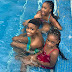 Timi Dakolo And Children Enjoy Swimming Together.