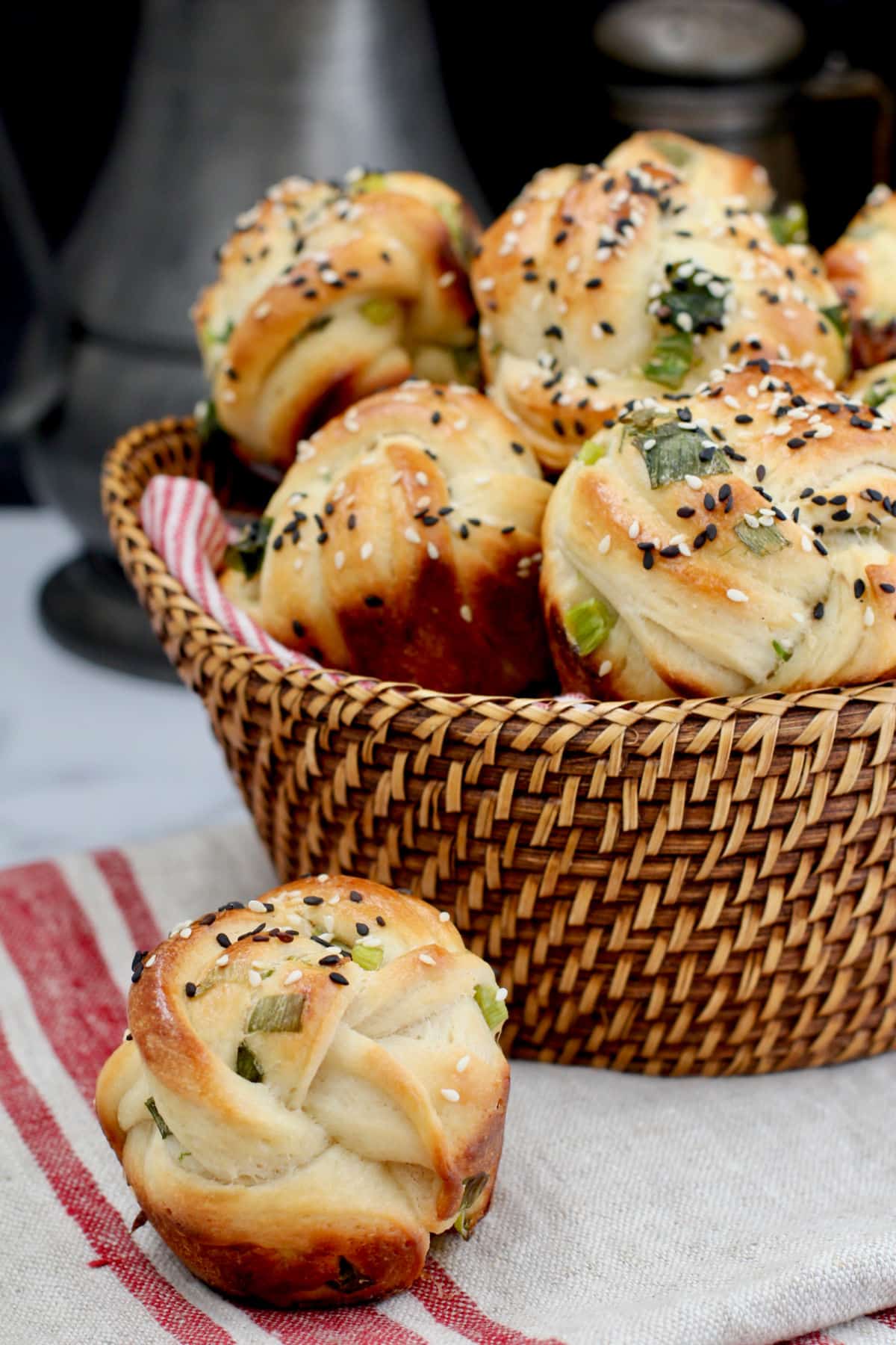 Scallion and Sesame Rolls in a basket.