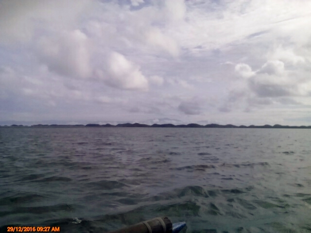 The cool calm water of Lingayen Gulf where the islands are scattered
