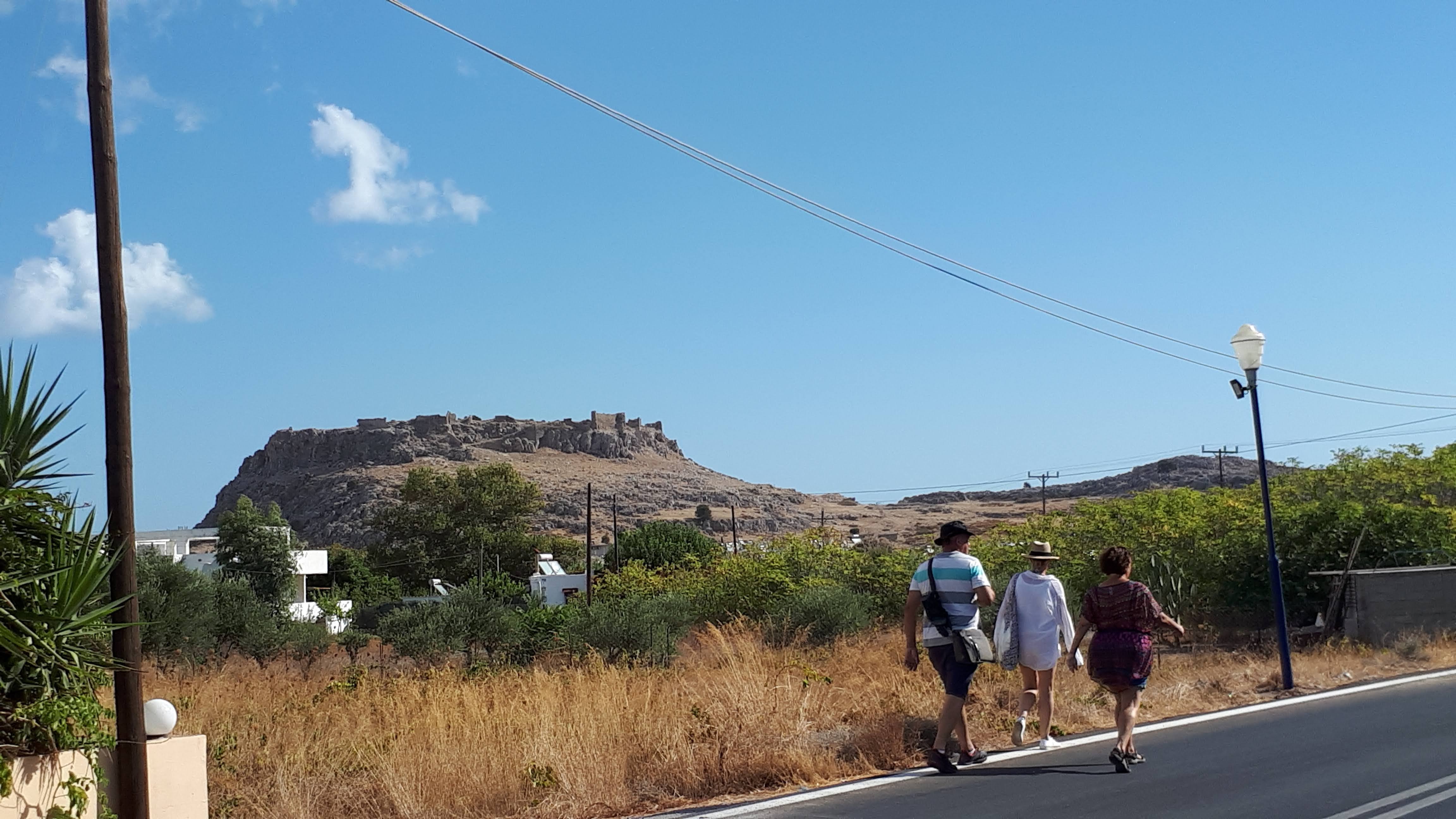 The walk into the village from the main road, with Faraklos castle in the distance