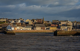 Photo of Maryport from across the basin at high tide