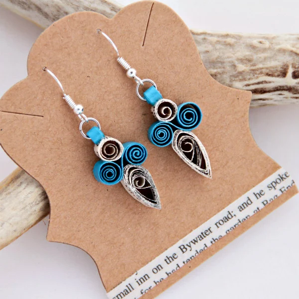 Quilled earrings made of turquoise paper and book page strips