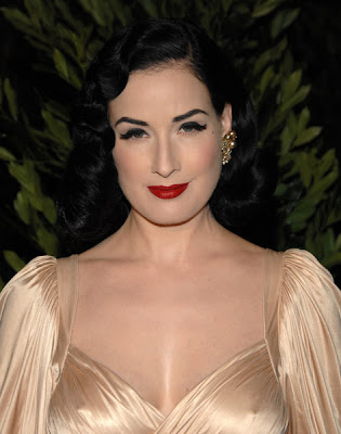 I know the color washes Dita Von Teese out but she looks absolutely divine