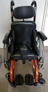 orange pediatric wheelchair photo