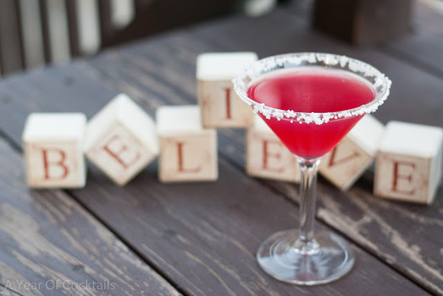 Tropical Christmas Cosmo, christmas cocktail, tropical punch vodka, cranberry juice, lime juice, triple sec