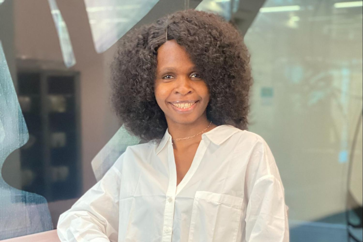 Headshot of Ezinne Osuamadi smiling