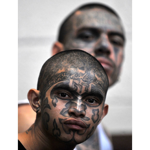 Tattooed members of the Mara 18 gang are held at a courtroom in Guatemala