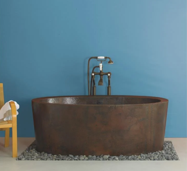 Copper bathtub in a spa like bathroom.