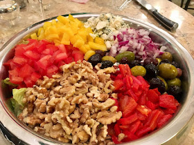 Incredible salad with nuts, olives, red peppers, onions, etc. 