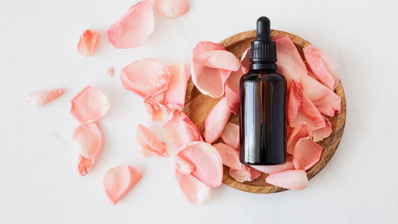 liquid soap sitting in a bowl full of pink flowers | 10 Product Photography Ideas