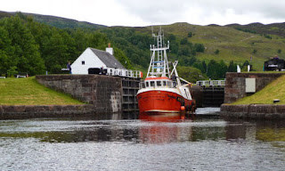 A beautiful picture of a ship at the caledonian canal