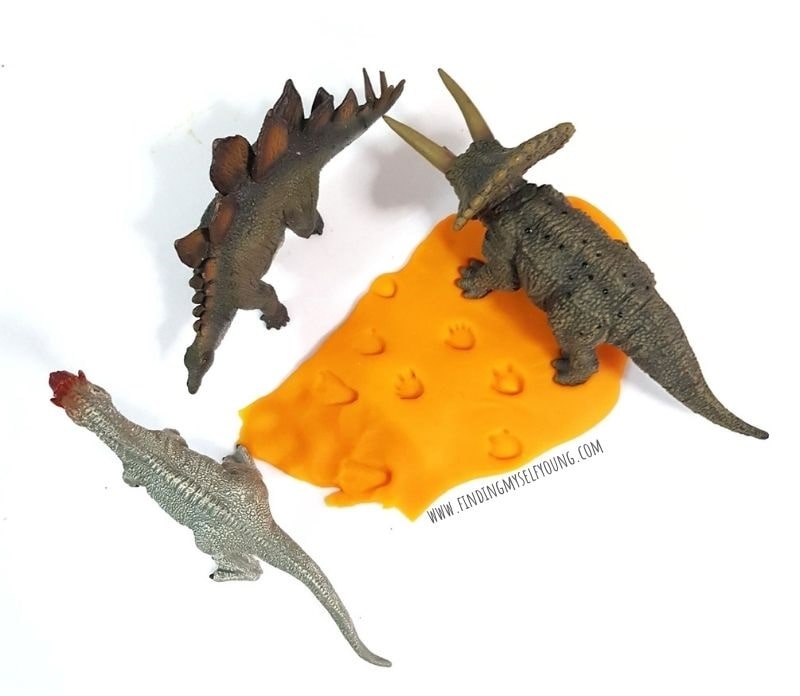 dinosaur footprints in playdough