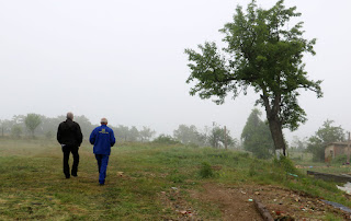 The boss man walks with the driver