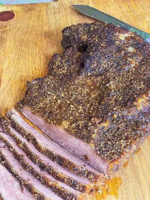 Oven Smoked Brisket is tender meat that tastes like it has been smoked in a smoker for hours.  You don't need a smoker to enjoy this mouthwatering oven smoked brisket.