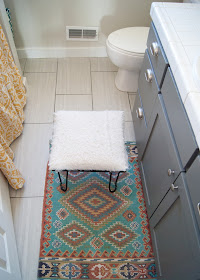 Bathroom Makeover - before & after - World Market rug / mat and vintage hairpin leg stool 