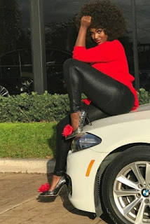Amara La Negra posing for the picture with the car