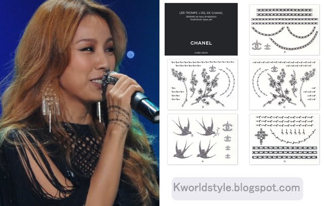 The tattoo could be those "Chanel" paper attachment non-permanent tattoo 