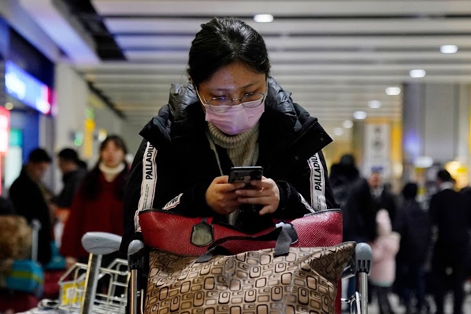 China urges citizens to delay foreign travel over virus fears