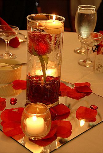 wedding centerpieces with candles and poinsettias