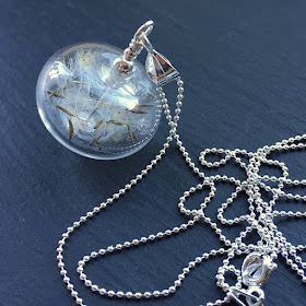 Blown lampwork glass bead and dandelion seed necklace by Laura Sparling