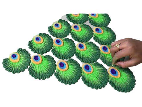 latest rangoli design of peacock 