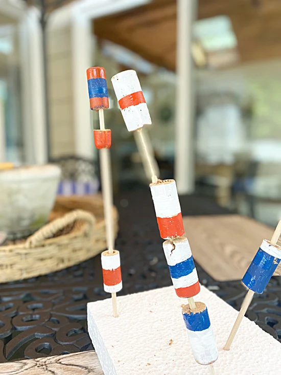 painted corks on skewers