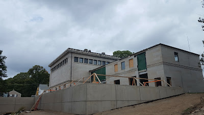 work underway to expand the library in the back of the current building