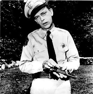 Barney Fife putting his bullet in his pistol