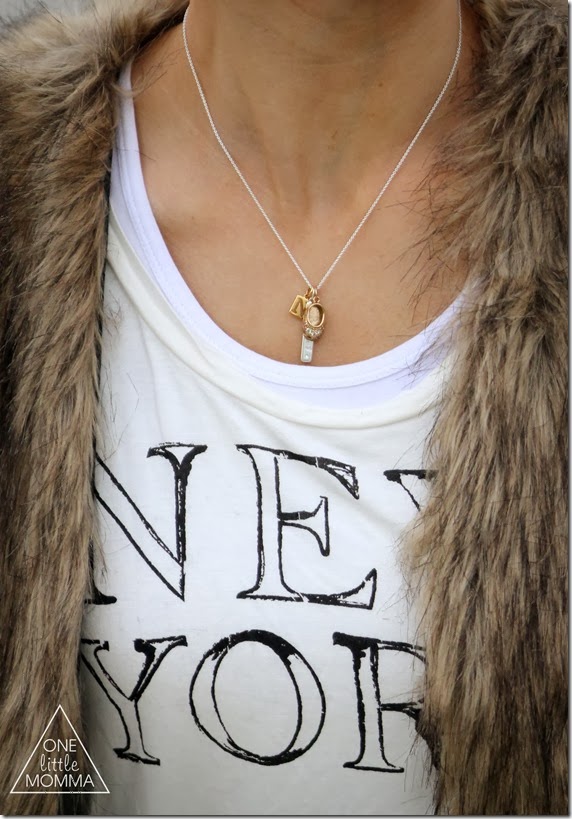 Fur vest, graphic tee and dark denim