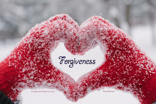 Two hands in red gloves forming a heart-shape with "Forgiveness" in the heart.