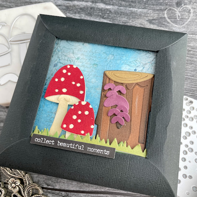 Mushroom and tree stump panel made with cardstock, stamps and die cuts.