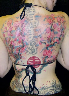 Lower back Cherry Tribal tattoo paint