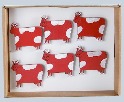 magnets shaped like cows, red and white