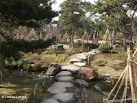 Rope 'tents' for winter protection along stone path - Kenroku-en Garden, Kanazawa, Japan