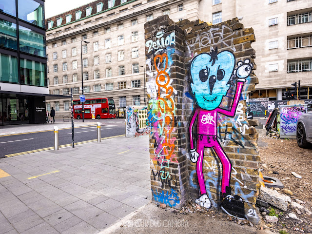 Graffiti on the reamins of a wall near The Vaults Tunnel in London