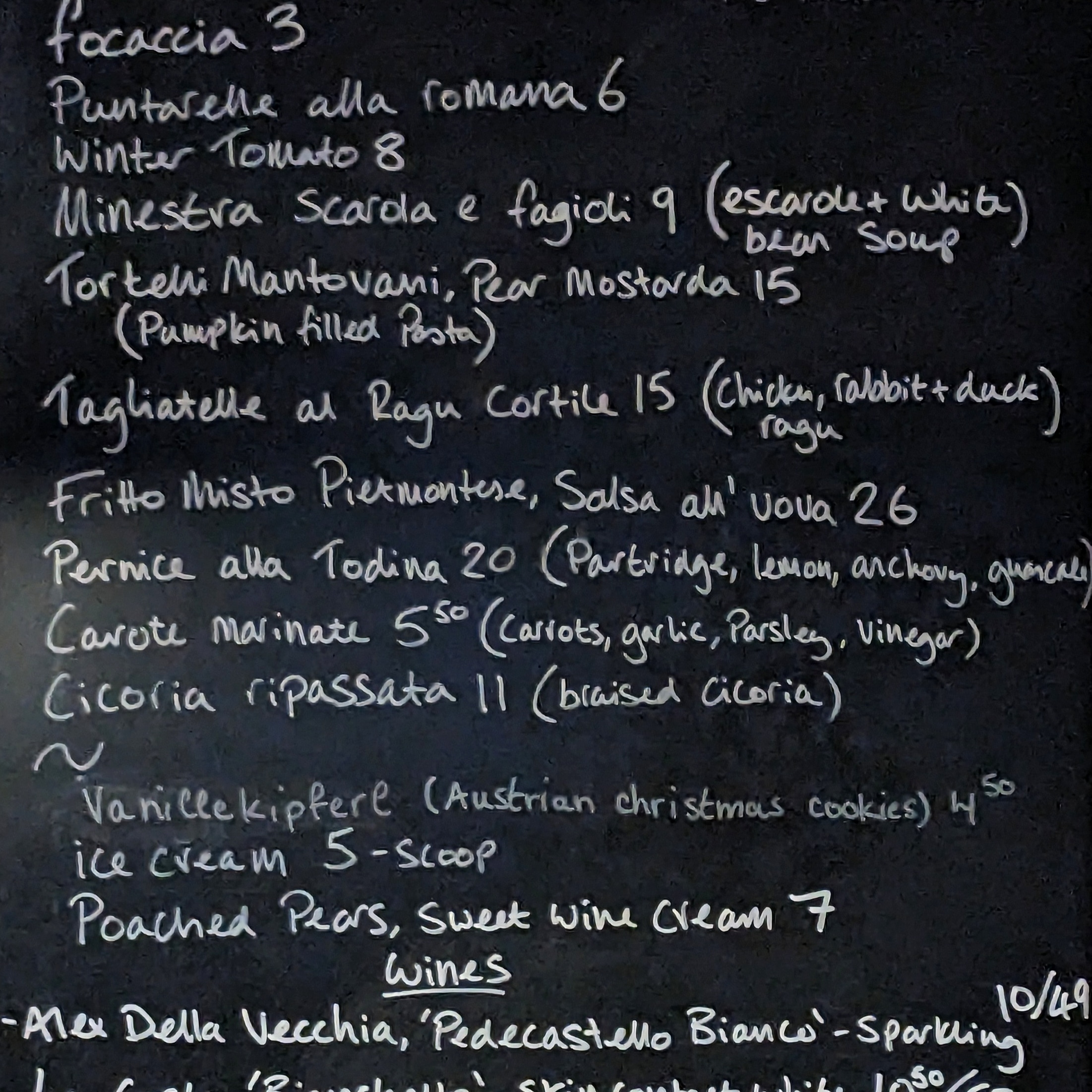 A chalkboard menu at Polentina in east london, one of the most authentic Italian restaurants in london