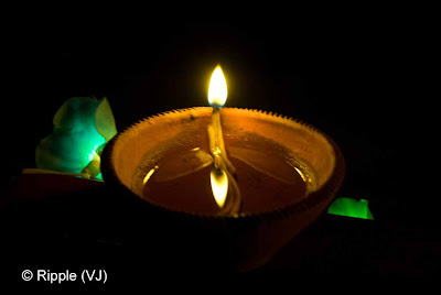 Posted by Ripple (VJ) : Diwali Celebrations 2008 (Indian Festivals of Lights): Diya with symmetrical reflection