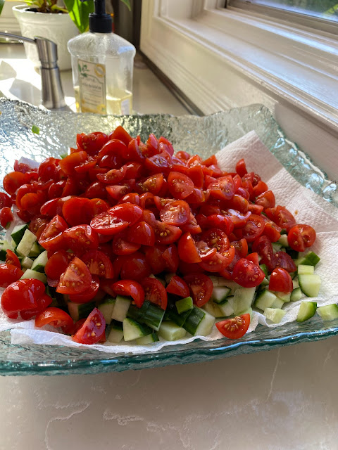 Israeli tomato and cucumber salad on a platter