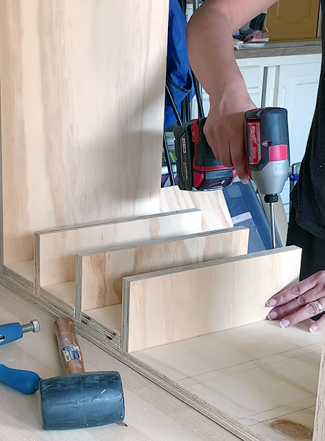 Husky small parts organizer stacked in cabinet