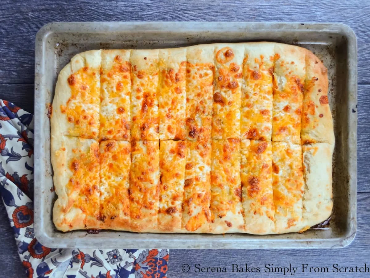 A pan of baked Cheesy Breadsticks looking down.