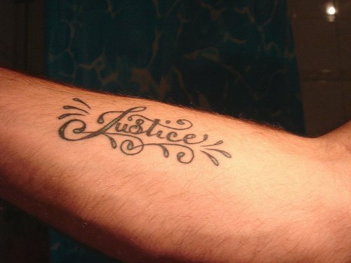 Word existence and art are created and emphasized by the tattoo font