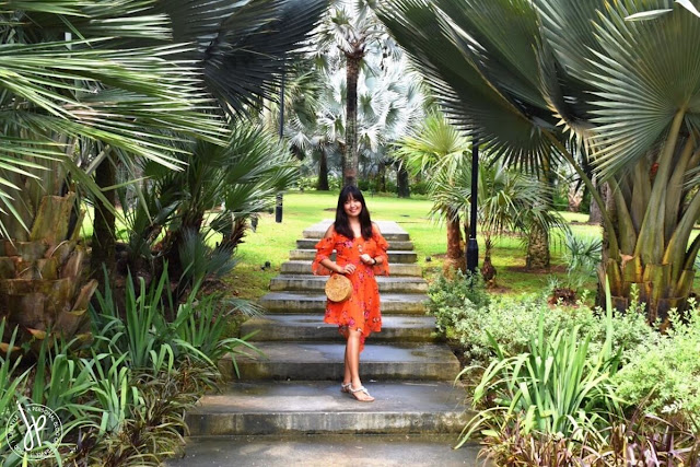 lady in orange summer dress