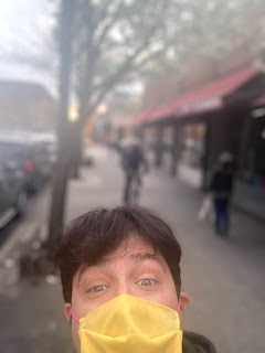 Greig Roselli wears a yellow mask in Jackson Heights, Queens