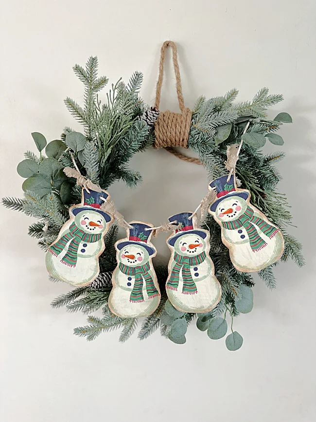 snowmen hanging on wreath