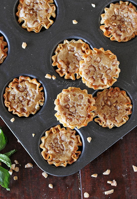 Top View of Mini Coffee-Toffee Crunch Cheesecakes in Pan Image