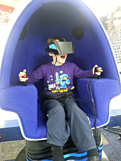 Boy taking part in a 9D virtual reality experience